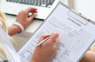 form Female doctor hold clipboard pad