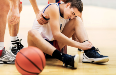 sports injuries boy suffering from basketball injury