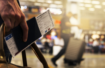 traveling Passport in hand in airport